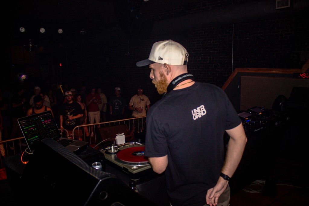 ANDY BRUH on the LED wall, silhouette at the decks