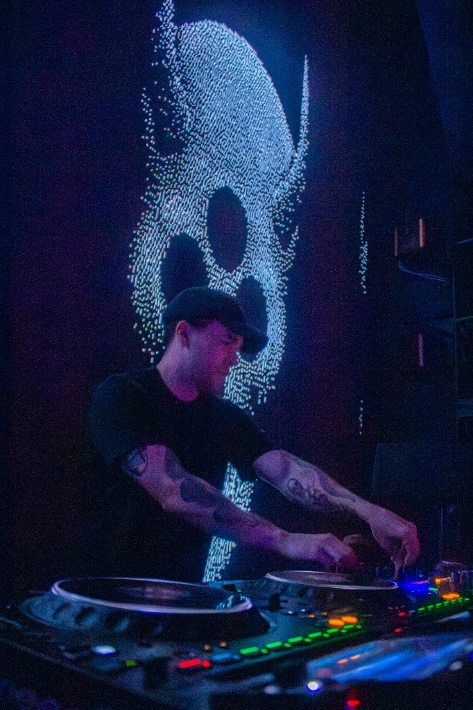 Eptic at the mixer, skull graphic on the LED behind him
