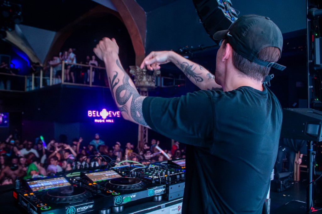 Eptic at the decks looking out over the crowd — Believe Music Hall