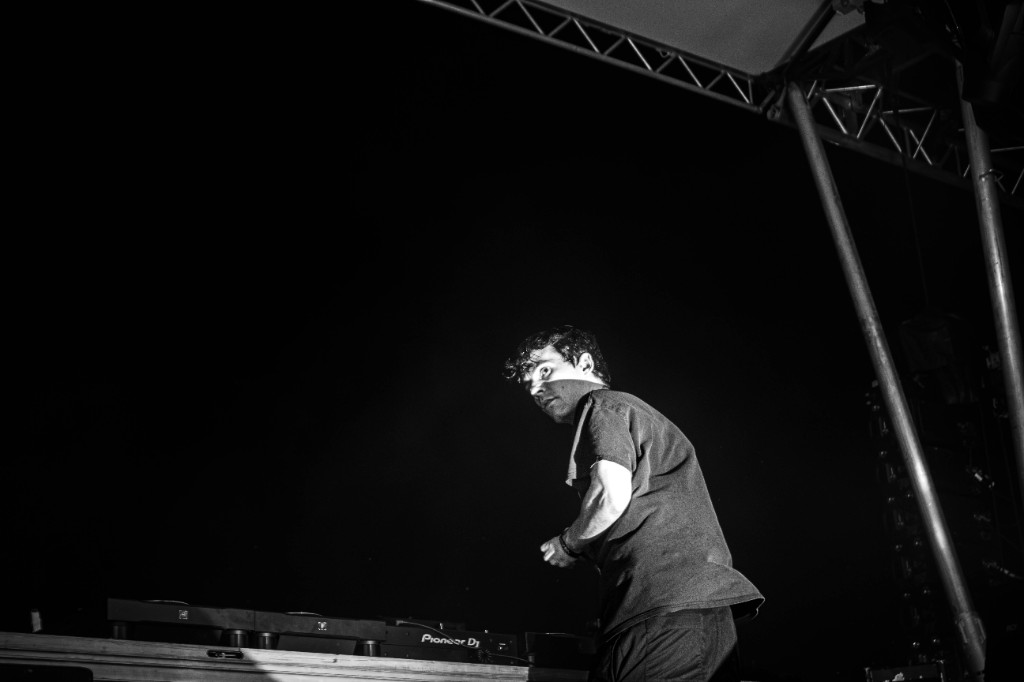 G Jones at the Pioneer DJ decks, looking over his shoulder