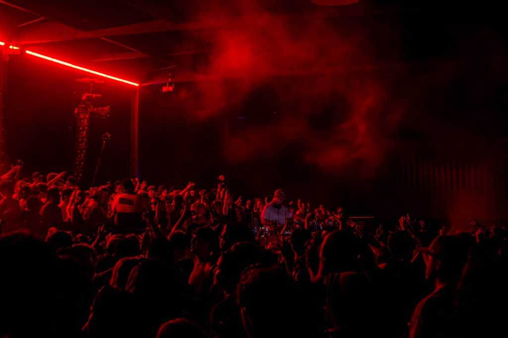 It's Murph at the decks under red wash, packed floor