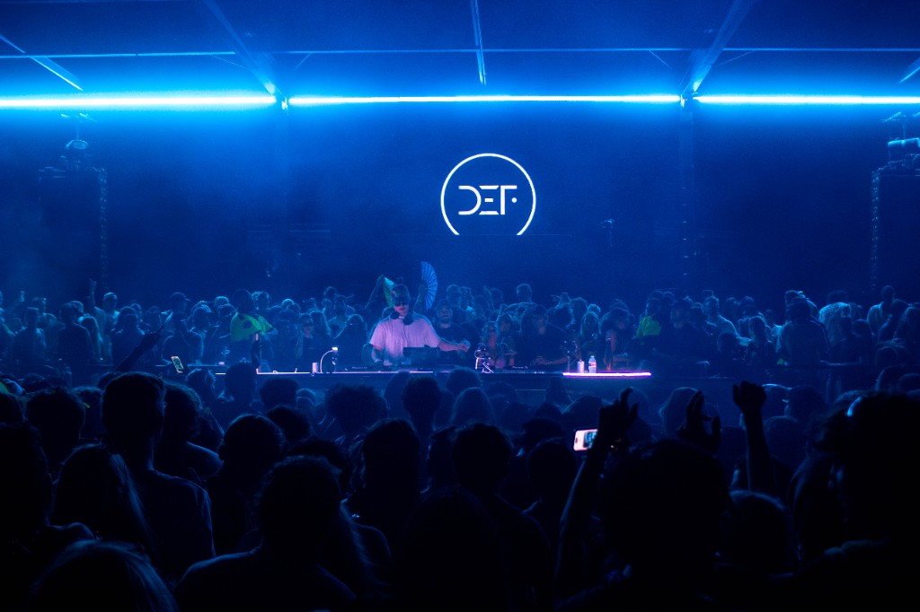 It's Murph at the booth, blue neon, DEF logo