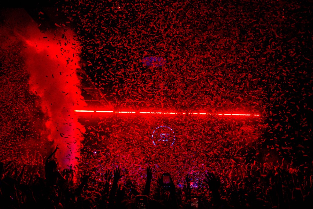 Red confetti and red bar over the crowd