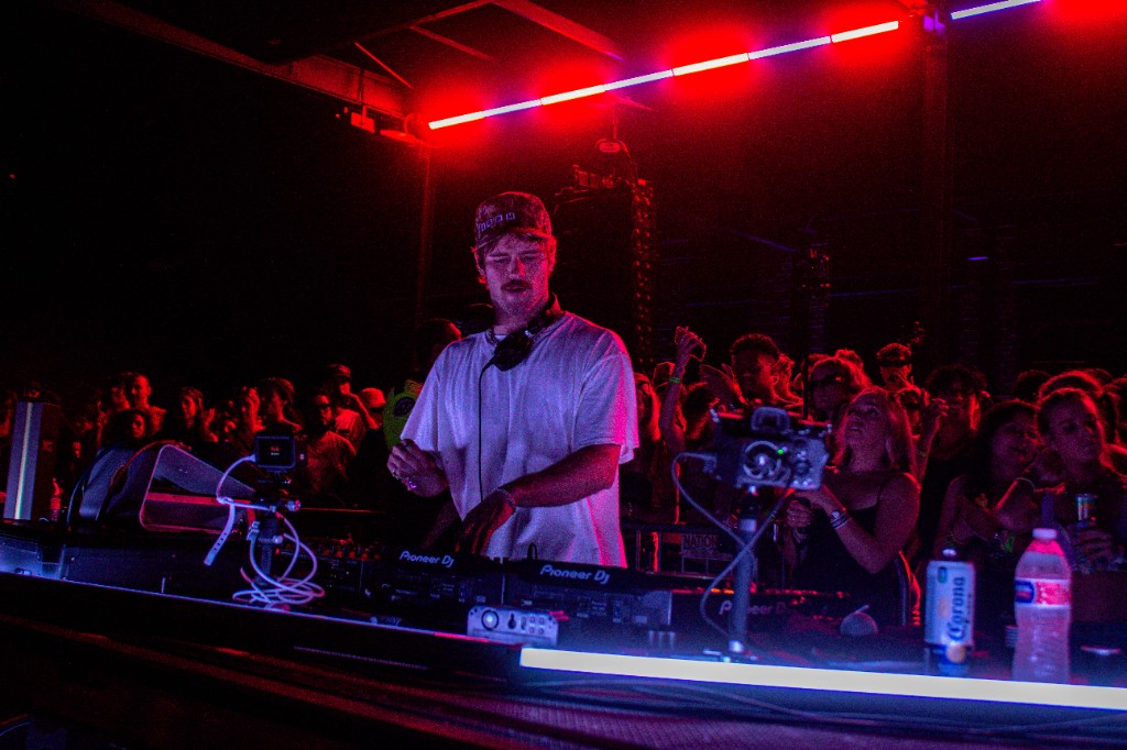 It's Murph at the Pioneer decks, red bar overhead — DEF: Warehouse