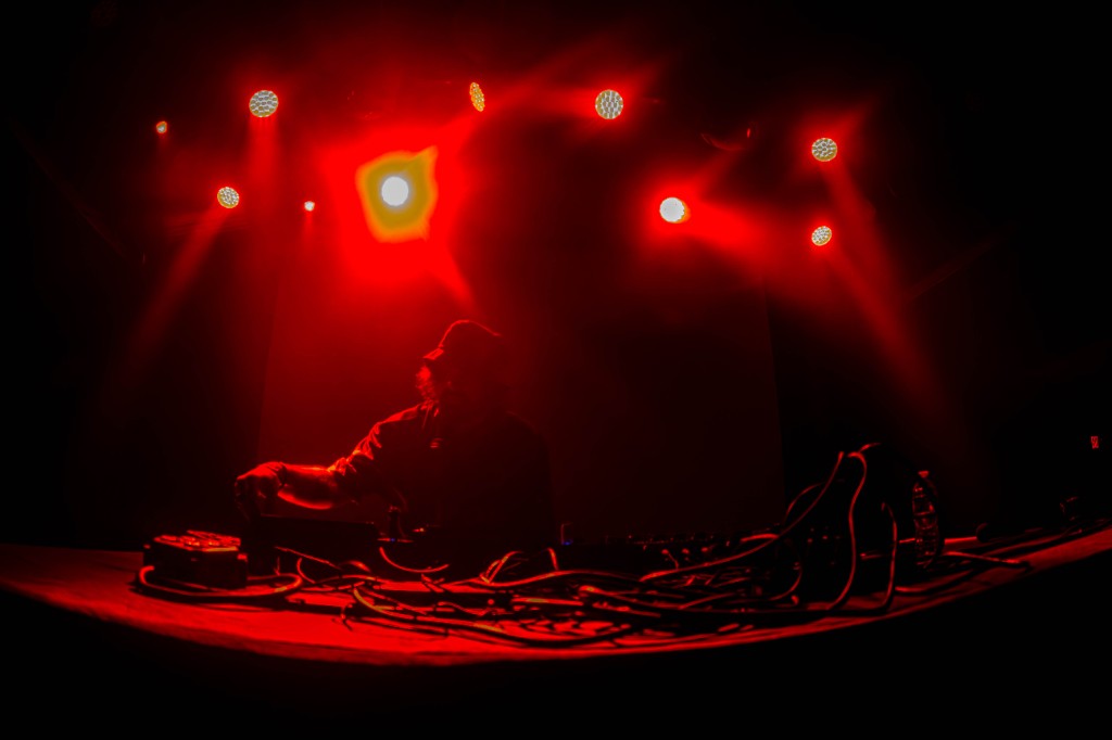 Truth silhouetted at the booth, red wash