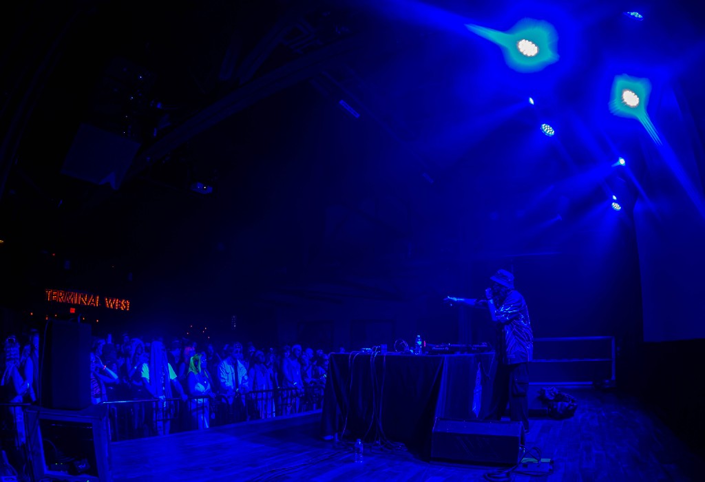 Truth at the booth, blue wash — TERMINAL WEST neon
