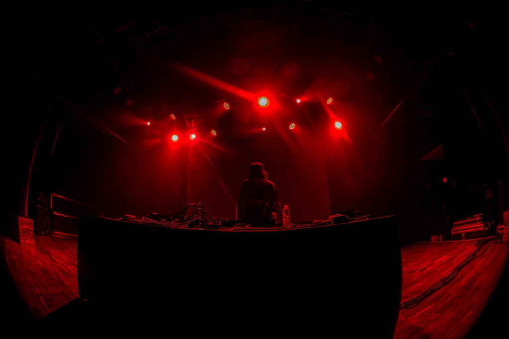 Truth silhouetted at the booth, red wash