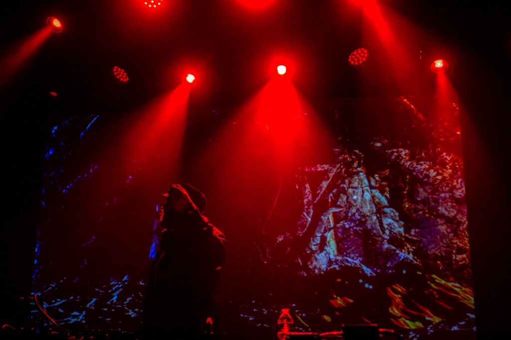 Truth silhouetted under red beams